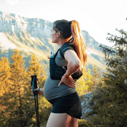 pregnant lady hiking in the mountains